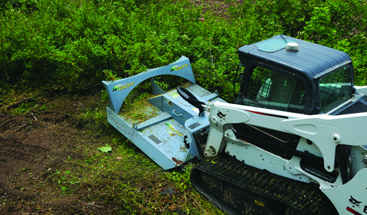 Top view of the skidsteer mounted Baumalight CF560 BrushCutt clearing a heavy brush