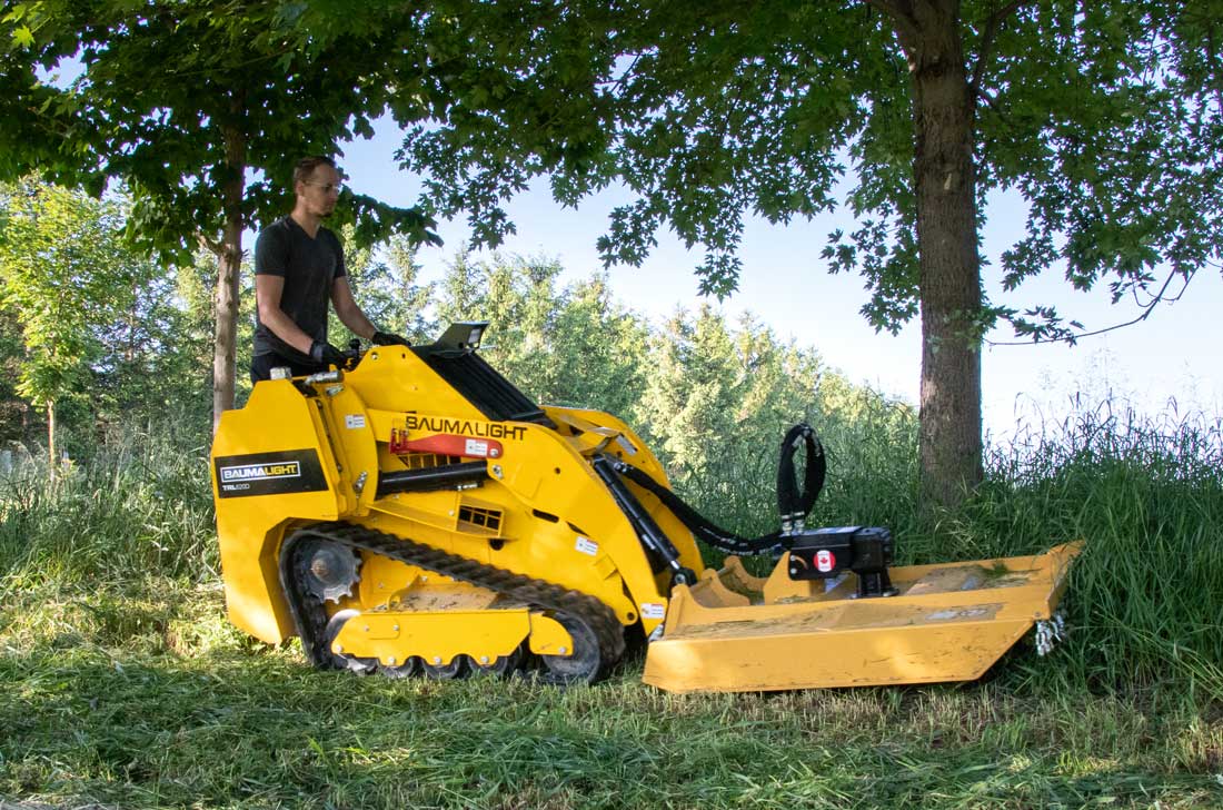 Martatch Rotary mower attached to a Baumalight mini skidsteer