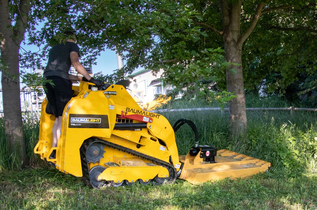 Martatch Rotary mower attached to a Baumalight Mini Track Loader