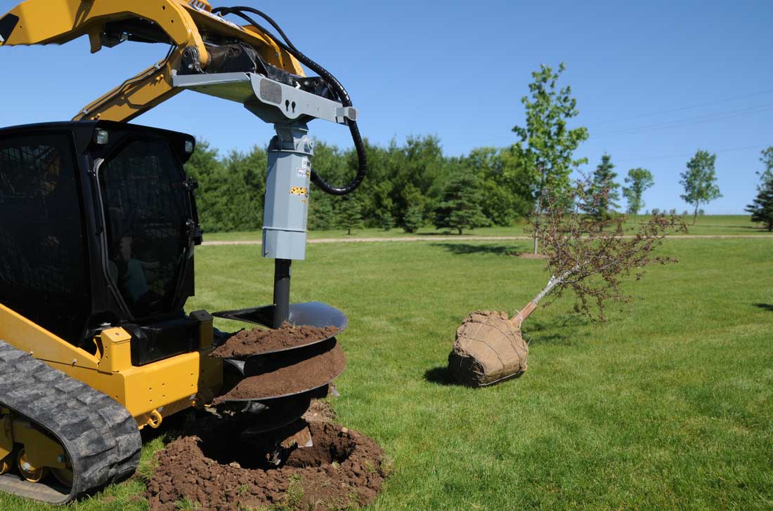 Land drilling with hydraulic auger on a skidsteer