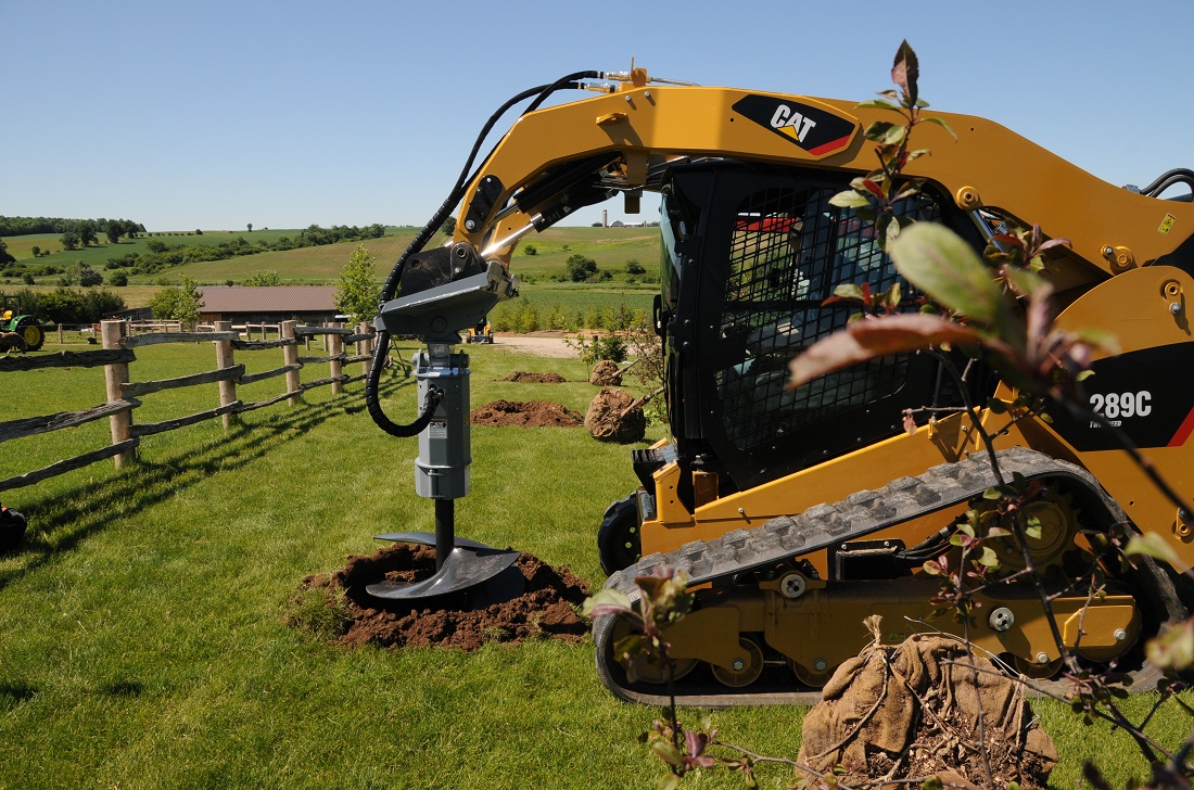 Baumalight hydraulic tree auger on 289c cat skidsteer