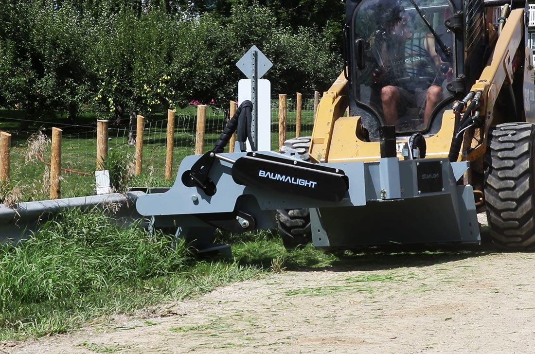 bms230 clearing brushes along guardrail