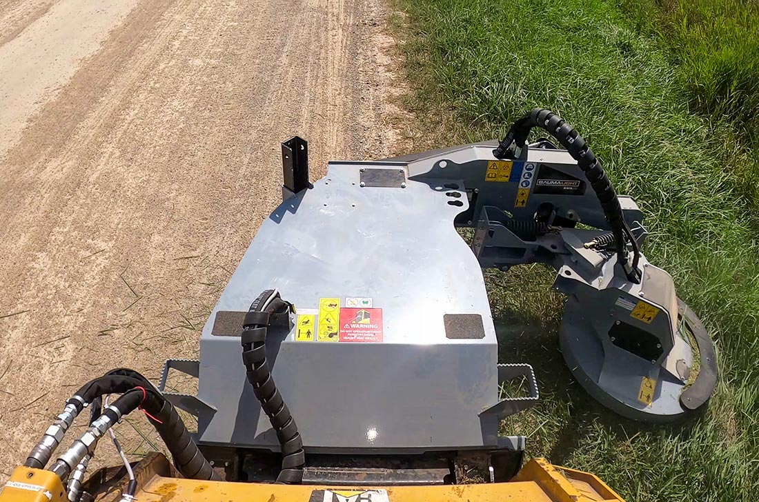 bms230 cutting overgrown brush along roadside