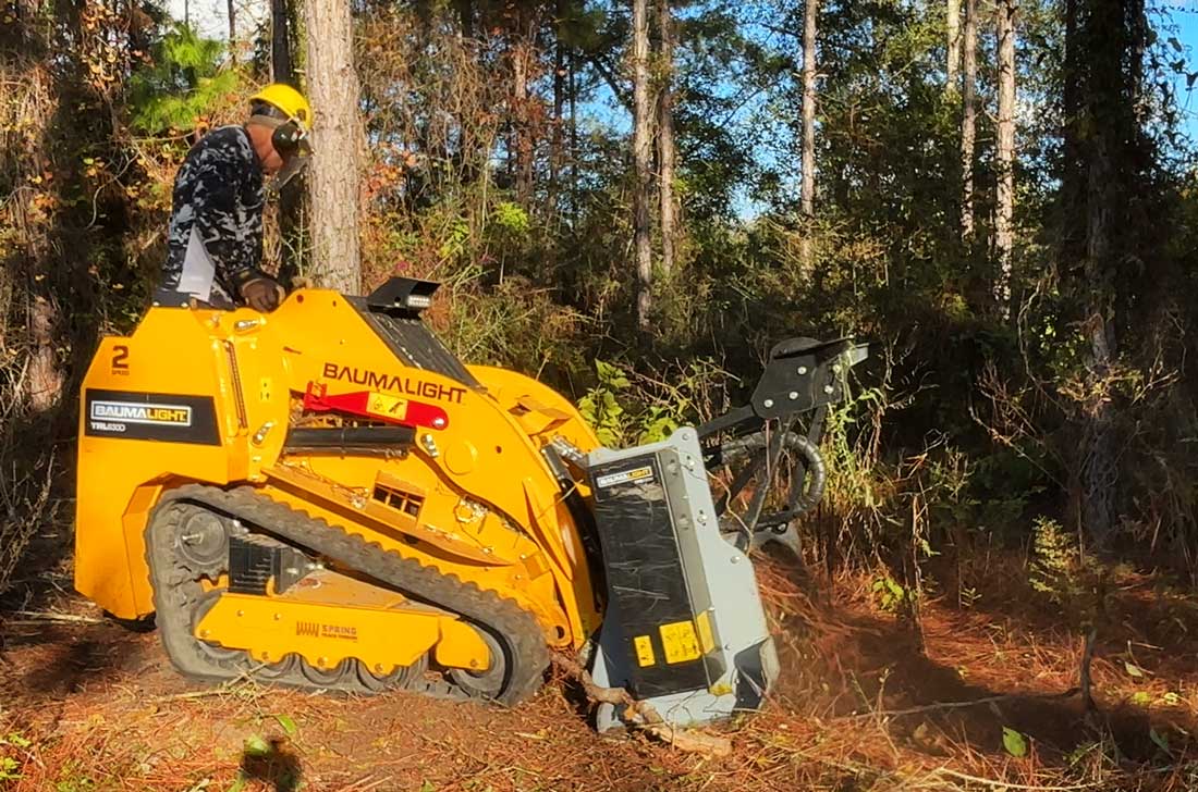 trl630d mini skidsteer in clearing action