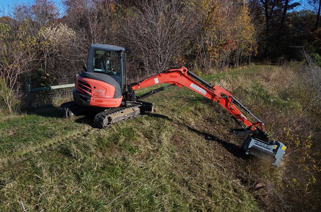 mx330 in clearing bushes near pond