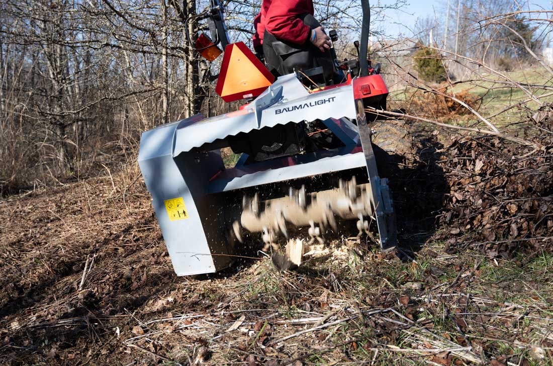 mp330 mulcher performing ground clearing task