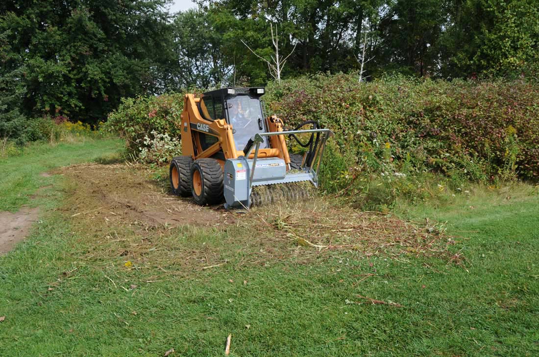 Brush mulcher on case skidsteer