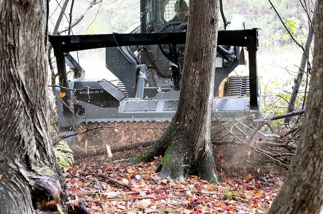 MS972 brush mulcher on tracked skidsteer