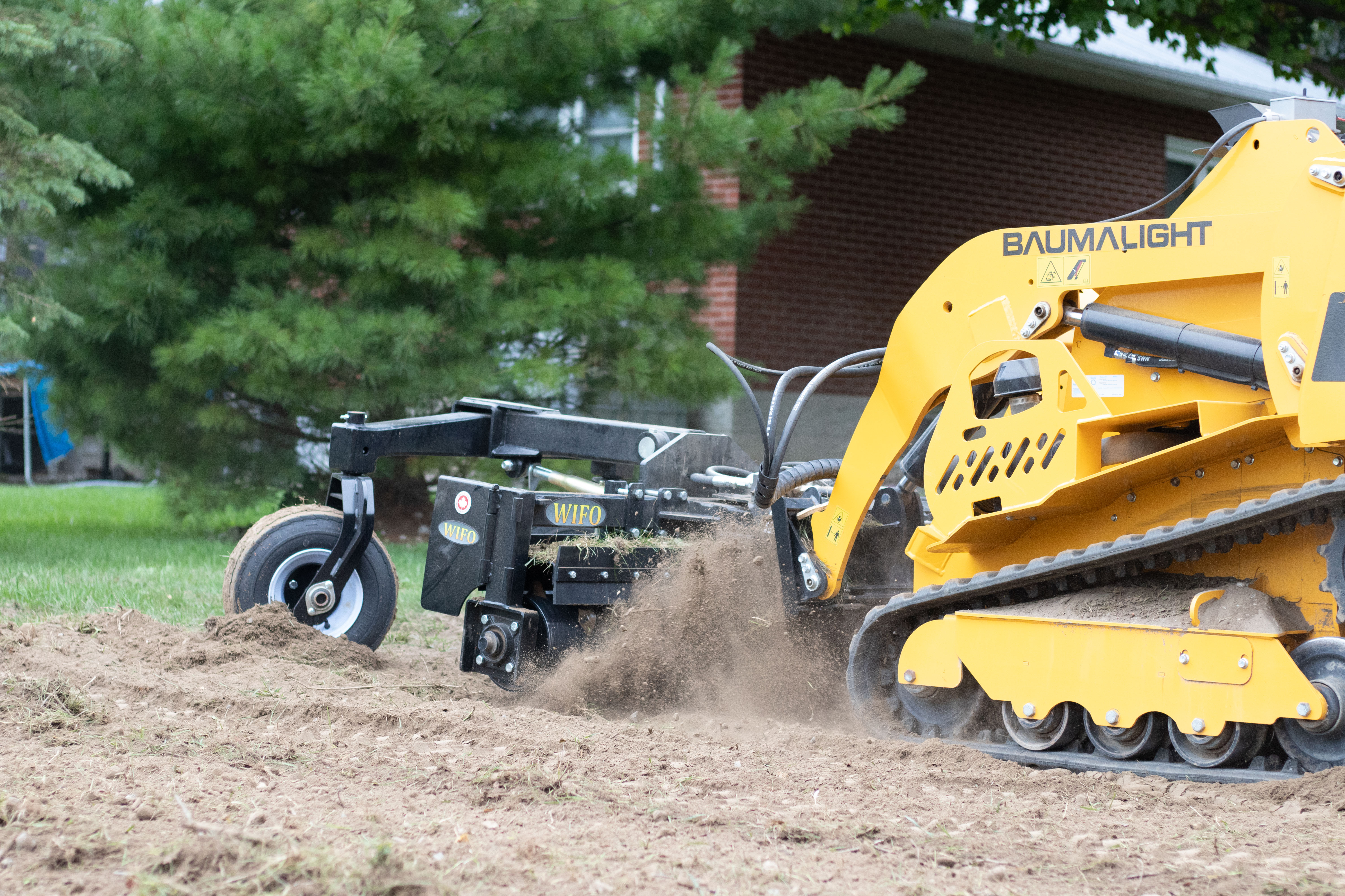 Baumalight Miniskidsteer with Power Rake Attachment