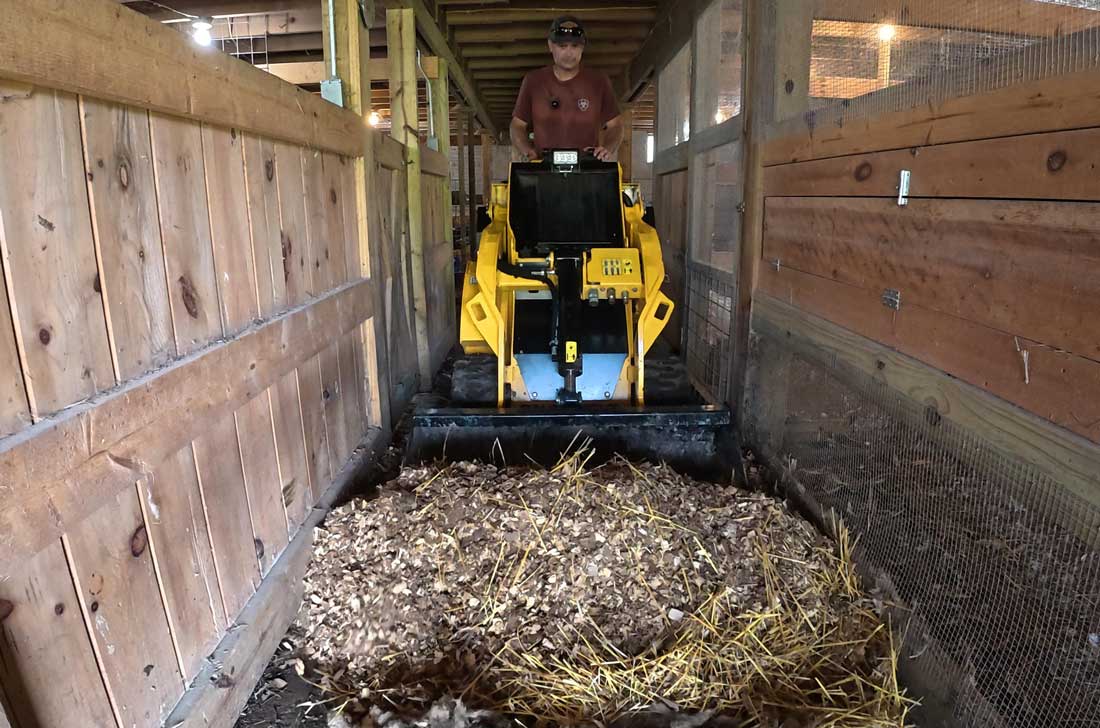 wheeled mini skid steer in action