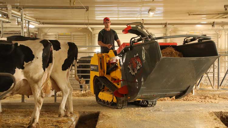 Front loading bale shredder and spreader