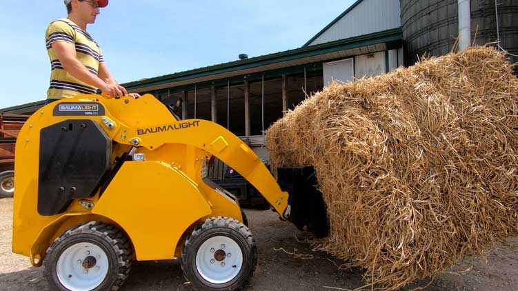 Baumalight wheeled miniskidsteer handling bale