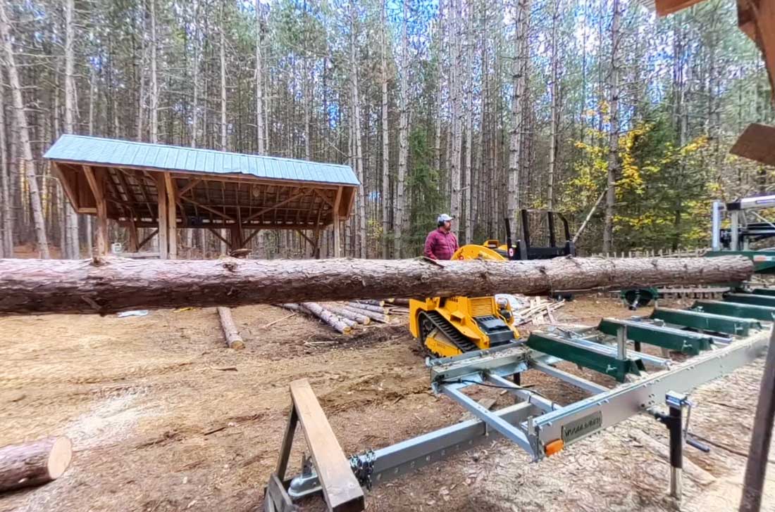 trl620d with fork lifting large stump