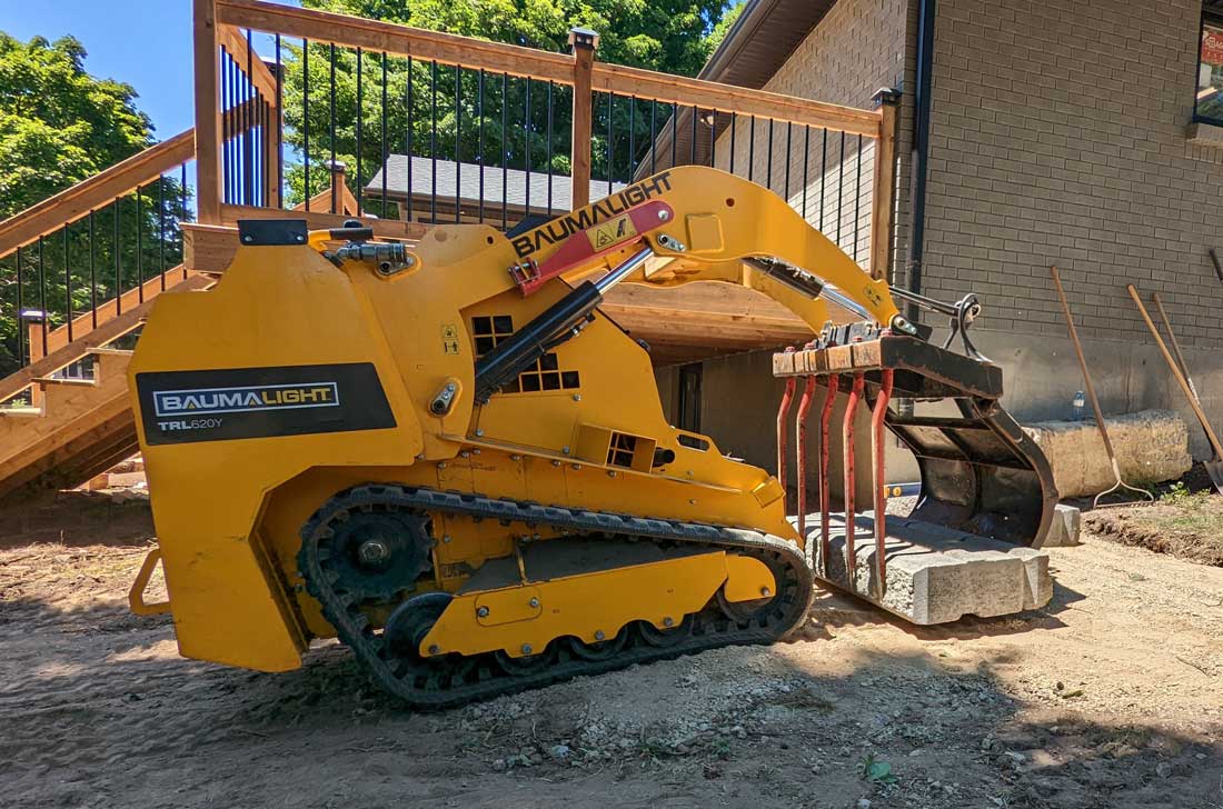 Manure grapple forks on mini skidsteer