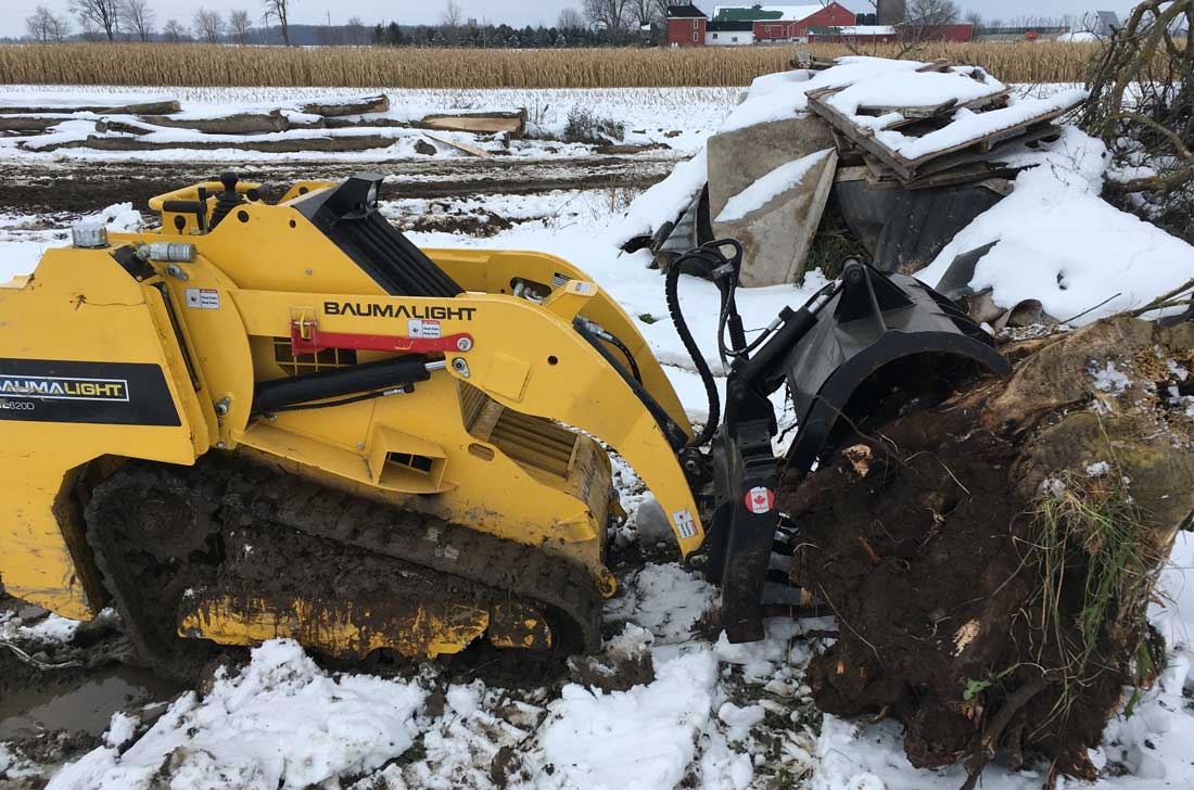 Tracked mini skidsteer with grapple forks