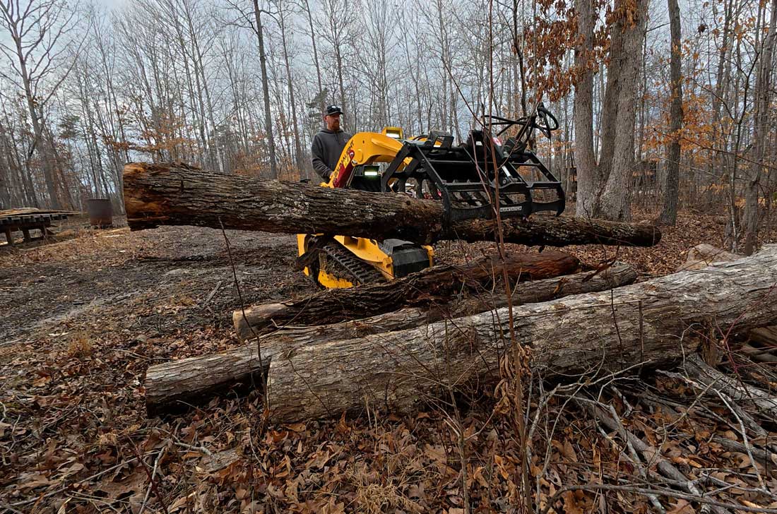 mini chargeuse compacte à grappin pour débris légers
