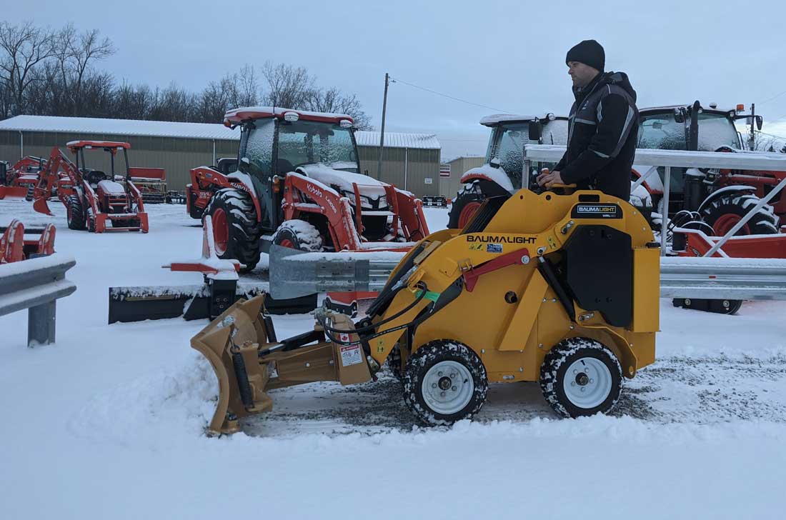 Snow blade on baumalight mini skidsteer