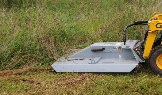 Front view of the skidsteer mounted Baumalight CF372 BrushCutt after clearing a heavy brush