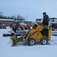 Snow blade on mini skidsteer