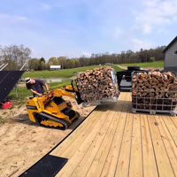 trl630d lifting firewoods using fork