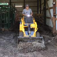 wheeled mini skid steer in action