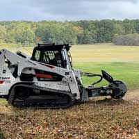 s28 skidsteer mulching stump on jobsite