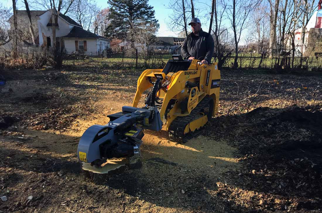 S16 Skidsteer stump grinder in action