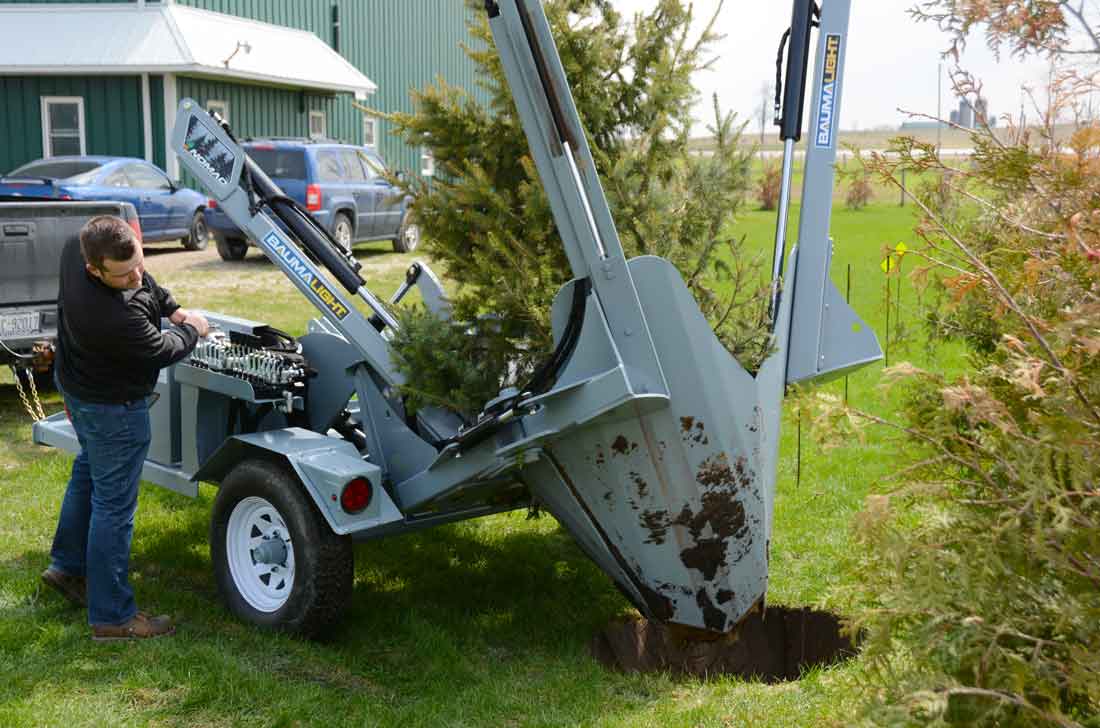 Baumalight trailer tree spade planting a tree